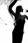 a silhouette of a woman dancing 