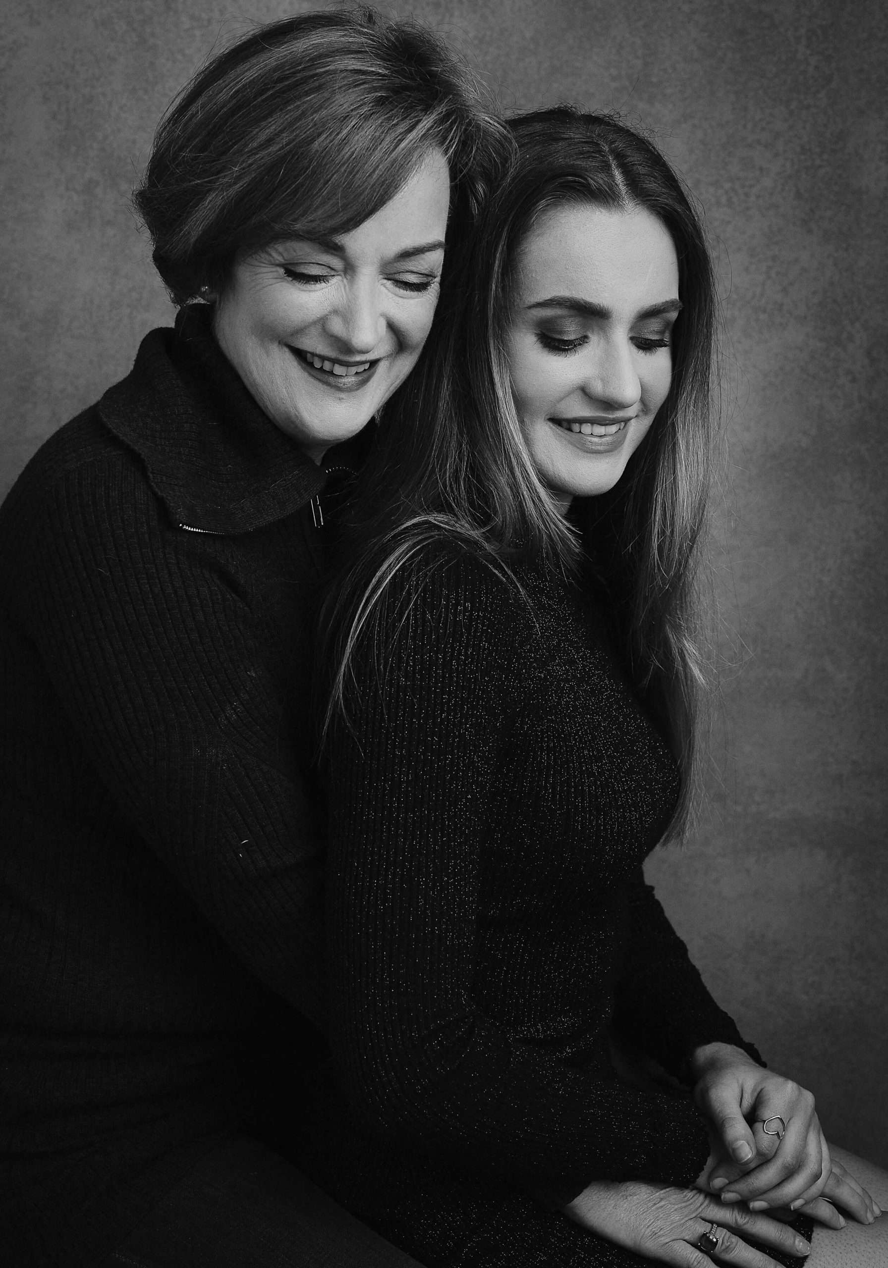 Elegant studio shot of a mother and daughter in vlack and white